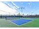 Two well-lit pickleball courts in a residential community at 4337 Sunmill Ct, Lakewood Ranch, FL 34211