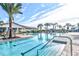 Resort-style pool with plenty of lounge chairs and umbrellas at 4337 Sunmill Ct, Lakewood Ranch, FL 34211