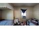 Small bedroom with window, bed, and wall-mounted air conditioner at 4352 17Th S Ave, St Petersburg, FL 33711