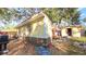 Backyard view of the house with a shed and grill at 4352 17Th S Ave, St Petersburg, FL 33711