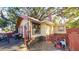 Backyard view of a house with a red fence and lawn at 4352 17Th S Ave, St Petersburg, FL 33711