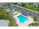 Aerial view showing pool, parking, and shuffleboard courts at 4424 Mount Vernon Dr, Bradenton, FL 34210