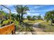 Landscaped backyard with a pathway and lush greenery at 4424 Mount Vernon Dr, Bradenton, FL 34210