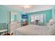 Bright bedroom with a king-size bed, built-in desk, and large window at 4424 Mount Vernon Dr, Bradenton, FL 34210