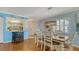 Dining room with a wooden table and white chairs at 4424 Mount Vernon Dr, Bradenton, FL 34210