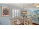 Charming dining area with wood table and white chairs at 4424 Mount Vernon Dr, Bradenton, FL 34210