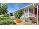 Exterior view showing a patio, lawn, and neighboring homes at 4424 Mount Vernon Dr, Bradenton, FL 34210