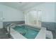 Inviting hydrotherapy pool with steps and handrails at 4424 Mount Vernon Dr, Bradenton, FL 34210