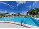 Large community swimming pool with plenty of lounge chairs at 4424 Mount Vernon Dr, Bradenton, FL 34210