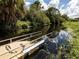 Floating dock with a metal ramp offers convenient water access at 4590 Oakley Rd, North Port, FL 34288