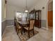 Formal dining room with wood table and hutch at 4590 Oakley Rd, North Port, FL 34288