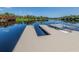 Community dock with steps for easy lake access at 4590 Oakley Rd, North Port, FL 34288