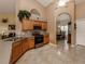 Kitchen with wood cabinets and stainless steel appliances at 4590 Oakley Rd, North Port, FL 34288