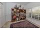 Study with built-in bookshelves and area rug at 4590 Oakley Rd, North Port, FL 34288