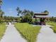 Relaxing covered picnic pavilion and seating area in a grassy park setting at 4590 Oakley Rd, North Port, FL 34288