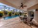 Relaxing pool area with covered patio and seating at 4590 Oakley Rd, North Port, FL 34288