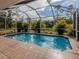 Refreshing screened pool and patio for outdoor enjoyment at 4590 Oakley Rd, North Port, FL 34288