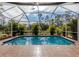 Inviting screened pool with ample deck space at 4590 Oakley Rd, North Port, FL 34288