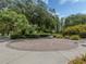 Brick sundial in a lush garden landscape at 4590 Oakley Rd, North Port, FL 34288