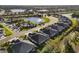 Aerial view of the neighborhood with lake and homes at 4649 Willow Bend Ave, Parrish, FL 34219