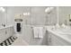 Elegant bathroom with a double vanity and a walk-in shower at 4649 Willow Bend Ave, Parrish, FL 34219