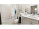 Clean bathroom with a shower/tub combo and modern vanity at 4649 Willow Bend Ave, Parrish, FL 34219