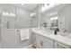 Modern bathroom with a large walk-in shower and double vanity at 4649 Willow Bend Ave, Parrish, FL 34219