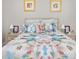 Guest bedroom with a floral comforter and nightstands at 4649 Willow Bend Ave, Parrish, FL 34219