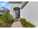 Quaint front porch with a bench and lush landscaping at 4649 Willow Bend Ave, Parrish, FL 34219