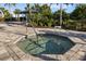 Octagonal hot tub with surrounding stone patio at 4649 Willow Bend Ave, Parrish, FL 34219