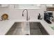 Modern kitchen sink with stainless steel sink and hexagonal backsplash at 4649 Willow Bend Ave, Parrish, FL 34219