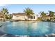 Resort-style pool with lounge chairs and palm trees at 4649 Willow Bend Ave, Parrish, FL 34219