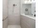 Large walk-in shower with grab bar and modern tile at 4649 Willow Bend Ave, Parrish, FL 34219