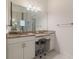 Bathroom boasts granite countertop, large mirror, and built-in vanity at 4839 Pastel Ct, Sarasota, FL 34240