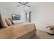 Guest bedroom with a queen-size bed and access to the backyard at 4839 Pastel Ct, Sarasota, FL 34240