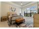 Main bedroom with king-size bed, light wood furniture, and large window at 4839 Pastel Ct, Sarasota, FL 34240