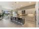 Modern kitchen with island, white cabinets, and granite countertops at 4839 Pastel Ct, Sarasota, FL 34240