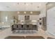 Modern kitchen with white cabinets, granite counters, and island at 4839 Pastel Ct, Sarasota, FL 34240