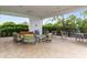 Outdoor patio area with seating and a covered area at 4839 Pastel Ct, Sarasota, FL 34240