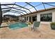 Enjoy this relaxing pool and patio oasis with comfortable seating at 4839 Pastel Ct, Sarasota, FL 34240