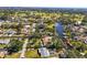 Aerial view of waterfront home with lush landscaping at 504 68Th Avenue W Dr, Bradenton, FL 34207