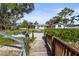 Wooden bridge leads to home's waterfront backyard at 504 68Th Avenue W Dr, Bradenton, FL 34207