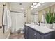 Bathroom with white subway tile and gray vanity at 504 68Th Avenue W Dr, Bradenton, FL 34207