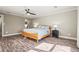 Light-filled bedroom with wood floors and a ceiling fan at 504 68Th Avenue W Dr, Bradenton, FL 34207