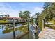 Private boat dock with lift on a peaceful canal at 504 68Th Avenue W Dr, Bradenton, FL 34207