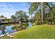 Serene canal view from the backyard, offering privacy and tranquility at 504 68Th Avenue W Dr, Bradenton, FL 34207