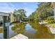 Serene canal view with neighboring docks at 504 68Th Avenue W Dr, Bradenton, FL 34207