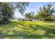 Spacious lawn with mature trees and a charming home at 504 68Th Avenue W Dr, Bradenton, FL 34207