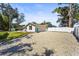 Spacious gravel driveway and partial home view at 504 68Th Avenue W Dr, Bradenton, FL 34207