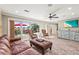 Bright living room featuring wood-look floors and a large window at 504 68Th Avenue W Dr, Bradenton, FL 34207